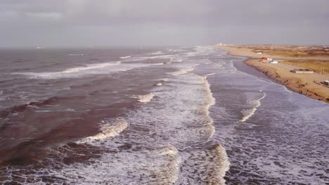 Aerial-View-Of-Rough-Sea-Waves-Along-Katwijk-aan-Zee-Beach-Coastline-In-South-Holland