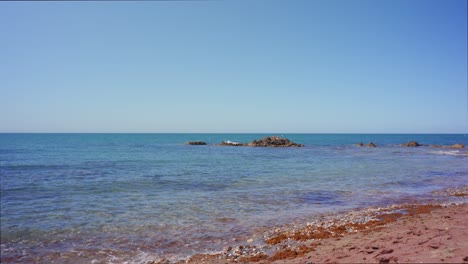 Calm-ocean-waves-at-Mijas-Costa,-Andalusia,-Spain