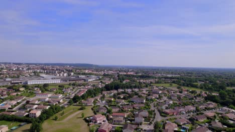 Outskirts-of-Montauban-Southern-France-with-residential-and-industrial-areas,-Aerial-pan-right-shot