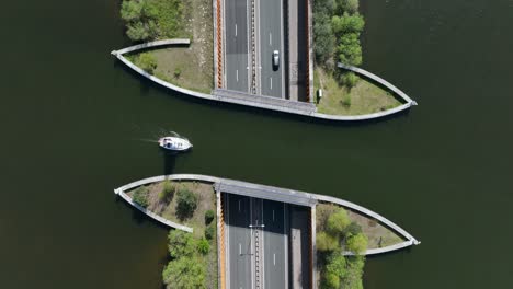 Aquaduct-Veluwemeer-water-bridge-with-boat-crossing-above-highway-traffic,-Aerial-view