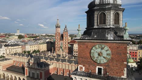 Aerial-view-of-the-clock-tower-in-Krakow's-main-square-and-St