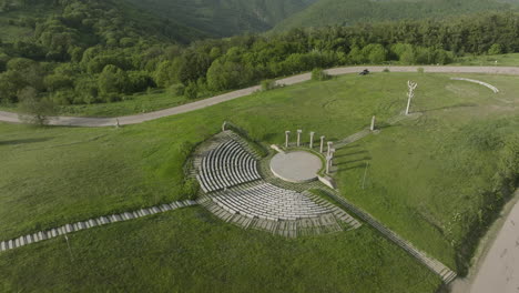 Aerial-birdseye-shot-of-an-empty-amphitheatre-and-the-Didgori-Valley-landscape