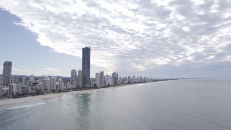 View-Of-High-rise-Buildings-By-The-Seafront-Of-Surfers-Paradise-In-Gold-Coast,-Queensland-With-Stunt-Plane-Suddenly-Flying-And-Put-On-A-Display