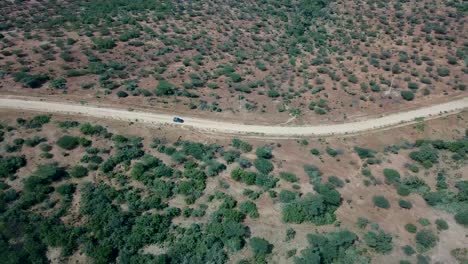 Jeep-driving-off-road-to-Omo-Valley-over-savanna-landscape-in-Africa