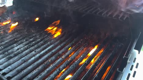 Tongs-Used-In-Removing-Cooked-Steak-From-Flaming-Grill