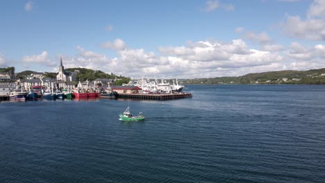 Drone-shot-of-a-small-irish-fishing-boat-coming-into-harbour