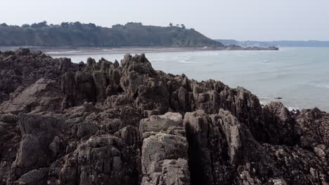 The-Rocky-Shore-of-Brittany's-Coastline-at-Martin-Plage-Aerial-Reveal