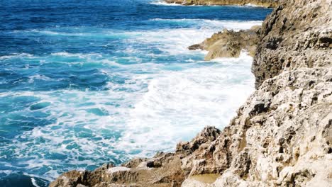 Powerful-sea-waves-crashing-on-rocky-coastline-of-Malta-island,-static-view