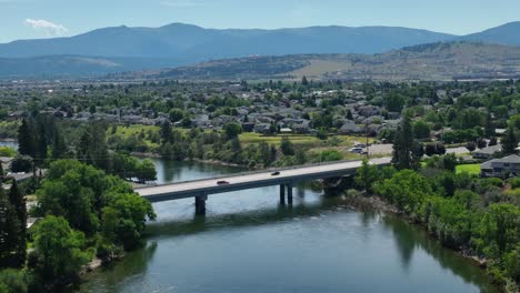 Orbiting-aerial-shot-of-a-bridge-crossing-the-Spokane-River-in-Washington-State