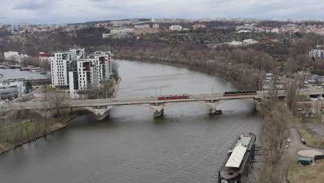 Trams-crossing-Vltava-river-over-Libensky-bridge-in-Prague-city