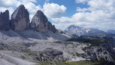 drone-flies-to-the-three-peaks-in-the-dolomites-in-italy,-beautiful-sunny-weather-with-few-clouds