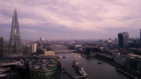 London-UK,-Aerial-View-of-Thames-River,-The-Shard-and-Sky-Garden-Skyscrapers-on-Cloudy-Evening,-Establishing-Drone-Shot
