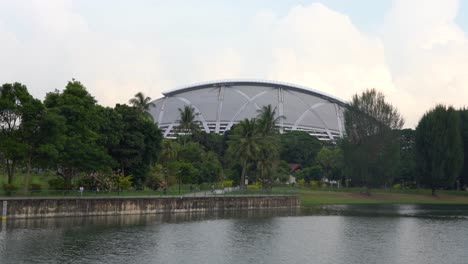 People-at-the-park,-Kallang-basin-and-National-Stadium-in-background