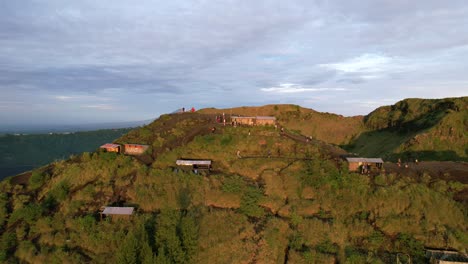 aerial-dolly-zoom-out-of-coffee-huts-on-a-volcano-rim-in-Bali-Indonesia