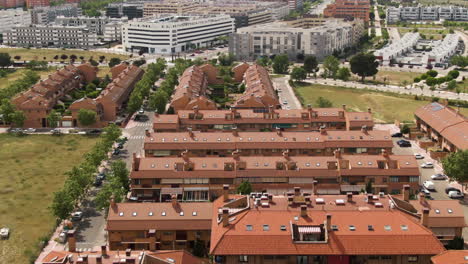 Spanish-living-district-of-apartment-building-on-hot-day,-aerial-fly-over-view
