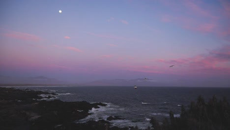 The-image-shows-a-coastal-landscape-at-sunset