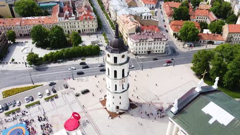 Iconic-bell-tower-of-Vilnius-Cathedral,-aerial-ascend-view