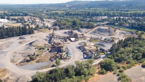 Orbiting-aerial-view-of-a-huge-concrete-quarry-yard-in-Healdsburg,-California