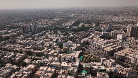 Drone-Flying-Over-Karachi-City-Skyline-In-Pakistan-With-Haze-Seen-In-The-Distance
