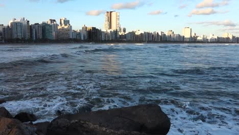 sea-undertow-waves-after-a-cyclone-passing-by-Santos-city-in-Brazil,-at-sunset