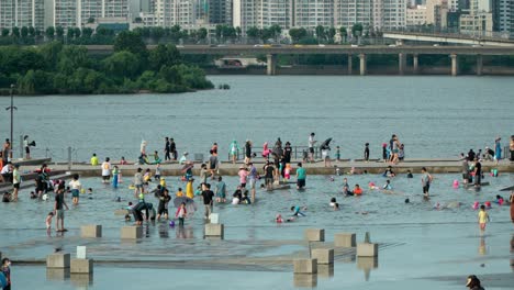 Korean-children-and-toddlers-with-Parents-enjoy-water-play-at-Yeouido-Hangang-Park-Cascade-Plaza