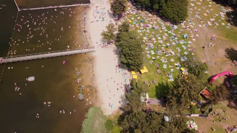 Big-crowd-enjoying-summer-weather-at-the-local-lake-beach