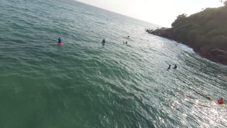 Orbit-Shot-Of-Team-Of-surfers-Getting-Ready-For-Action,-Sri-Lanka