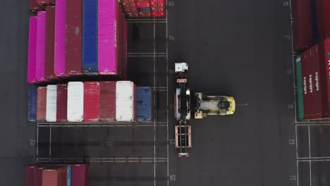 Top-View-Of-A-Container-Forklift-Working-On-Husky-Terminal-In-Port-Of-Tacoma,-Washington