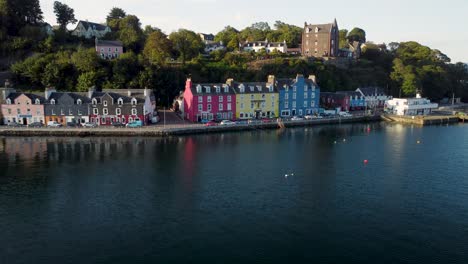 Picturesque-aerial-drone-shot-of-Tobermory-harbour-in-the-Isle-of-Mull-during-sunset