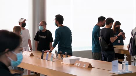 Shoppers-are-seen-testing-and-purchasing-Apple-brand-products-during-the-launch-day-of-the-new-iPhone-14-series-smartphones-at-the-official-Apple-store-in-Hong-Kong