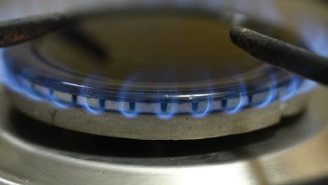 Close-up-of-burning-gas-burner-on-home-kitchen-cooktop