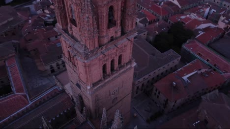 Close-up-aerial-view-of-the-tower-of-Salamanca-cathedral-and-cityscape-in-the-early-morning-light