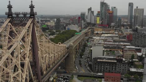 Aerial-drone-slide-alongside-the-Queensboro-Bridge-in-NYC-in-the-daytime