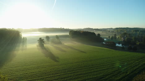 AERIAL:-Sunrise-over-a-misty-countryside-on-a-beautiful-morning