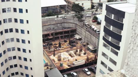 Building-Under-Construction-Surounded-By-Other-Buildings