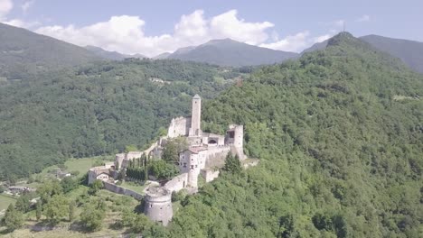Aerial-panoramic-view-of-Castel-Telvana-in-Borgo-Valsugana,-Trentino,-Italy-with-drone-flying-on-a-very-clear-day
