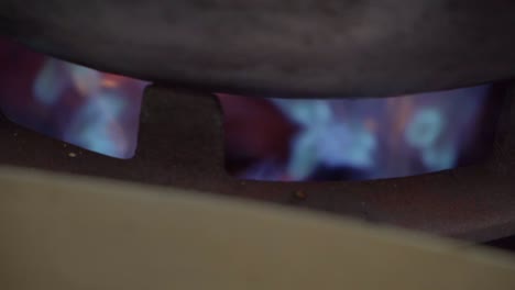 Commercial-kitchen,-giant-wok-flames-cooking-in-slow-motion