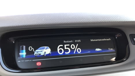 Static-view-onto-the-dashboard-of-an-electric-car-while-it's-charging