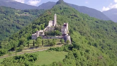 Aerial-view-of-Castel-Telvana-in-Borgo-Valsugana,-Trentino,-Italy-with-drone-flying-forward-on-a-very-clear-day