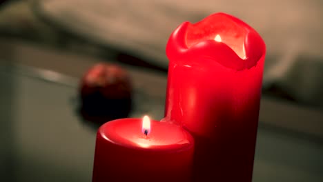 Close-up-of-two-candles-in-the-living-room