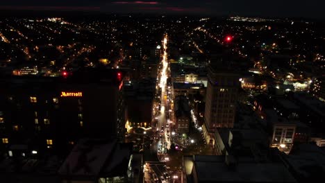 Aerial-traffic-circle-with-traffic-nighttime-downtown-Lancaster,-Pennslyvania