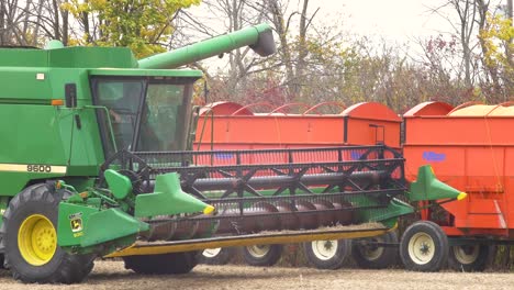 A-agricultural-combine-harvester-finishing-filling-up-trailer-with-soybean