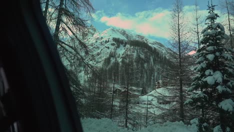 Slow-motion-footage-through-the-car-side-window-while-driving-in-the-Swiss-Alps