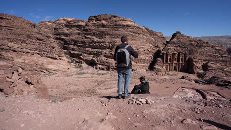 Couple-Talking-and-Enjoying-the-View-on-a-Hill-in-Front-of-the-Monastery-in-the-Antique-Site-of-City-Petra
