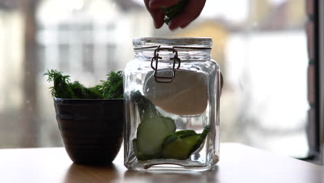 Filling-Glass-Jar-with-Fresh-Vegetables-for-Marinade-Cooking