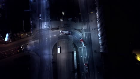 Fire-trucks-crossing-intersection-in-the-night