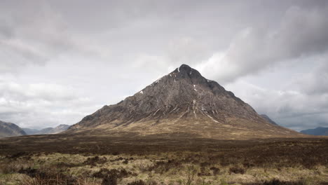 A-timelapse-of-Buachaille-Etive-Mor-mountain-with-clouds-passing-from-bottom-left-to-top-top-right-overhead,-Glencoe,-Scottish-Highlands,-Scotland