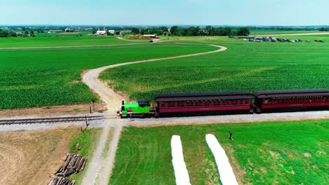 Thomas-the-Train-Steam-Locomotive-in-Amish-Countryside-on-a-Sunny-Summer-Day-as-seen-by-a-Drone