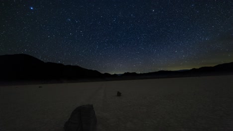 Inclined-panning-motion-time-lapse-of-the-milky-way-over-a-moving-rock-on-the-Racetrack-Playa