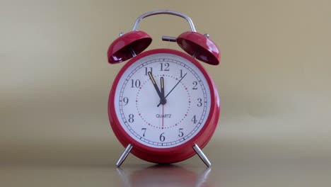 Red-alarn-clock-with-a-fast-second-hand-
